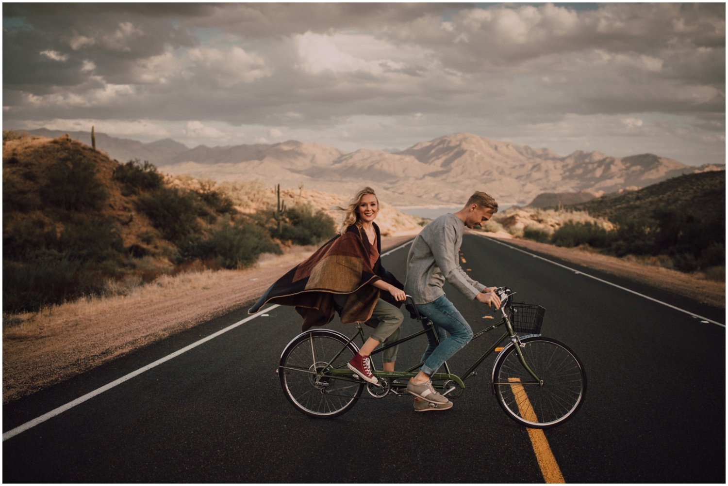 engaged couple bike engagement session in arizona