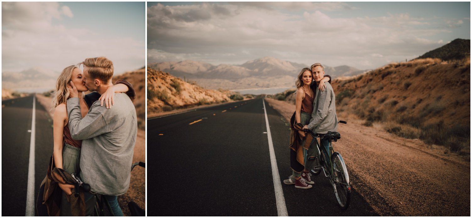 engaged couple riding their tandem bike in the desert