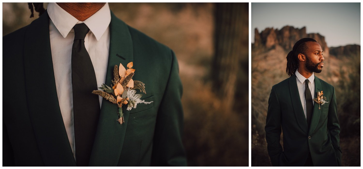 Groom wearing a emerald green suit and dried boutonniere in the desert 