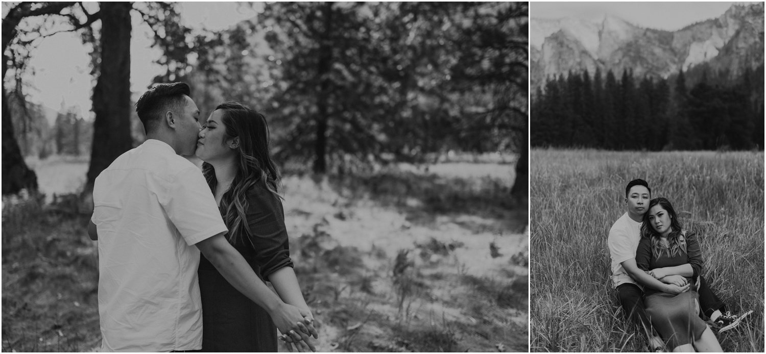 black and white photo engaged couple taking portraits in El Capitan meadow in Yosemite national park 