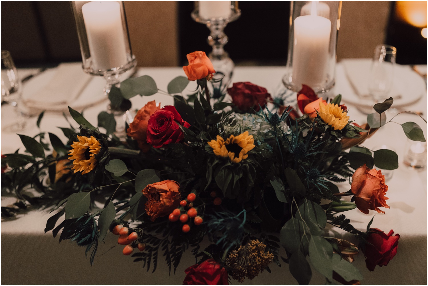 bride and groom's sweetheart table florals