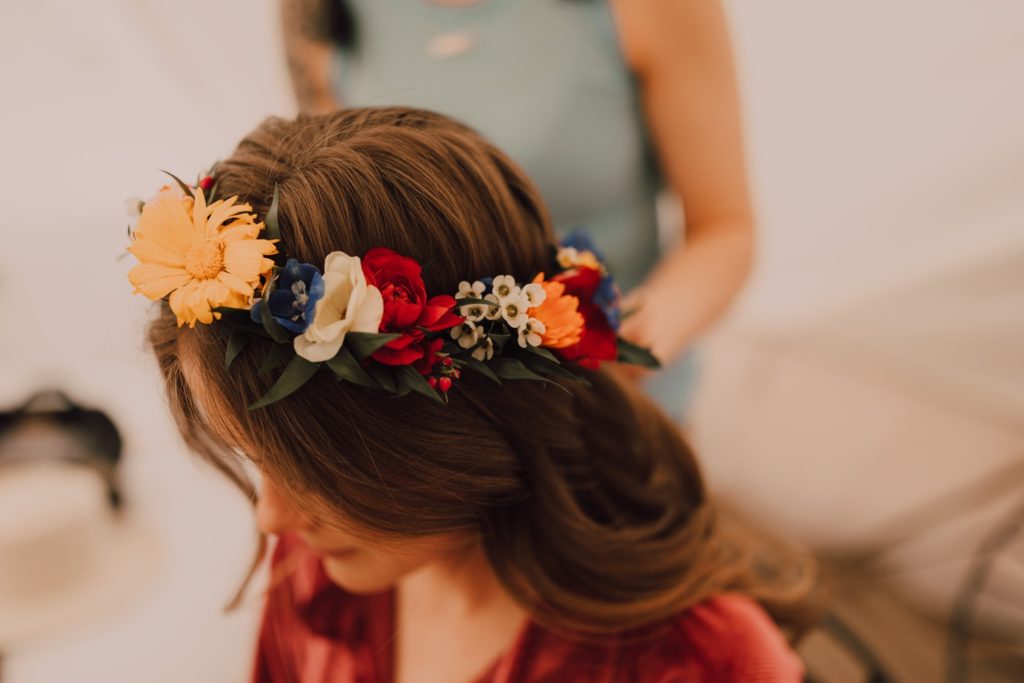Bride wearing colorful flower crown