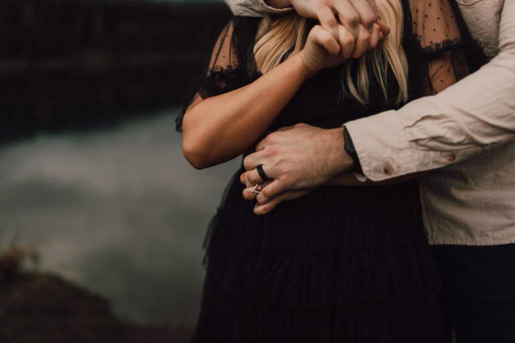 Engaged couple posing in the mountains for an overcast and moody Washington couples session, captured by Riss and Steven. Washington couples photographer, Washington wedding photographer