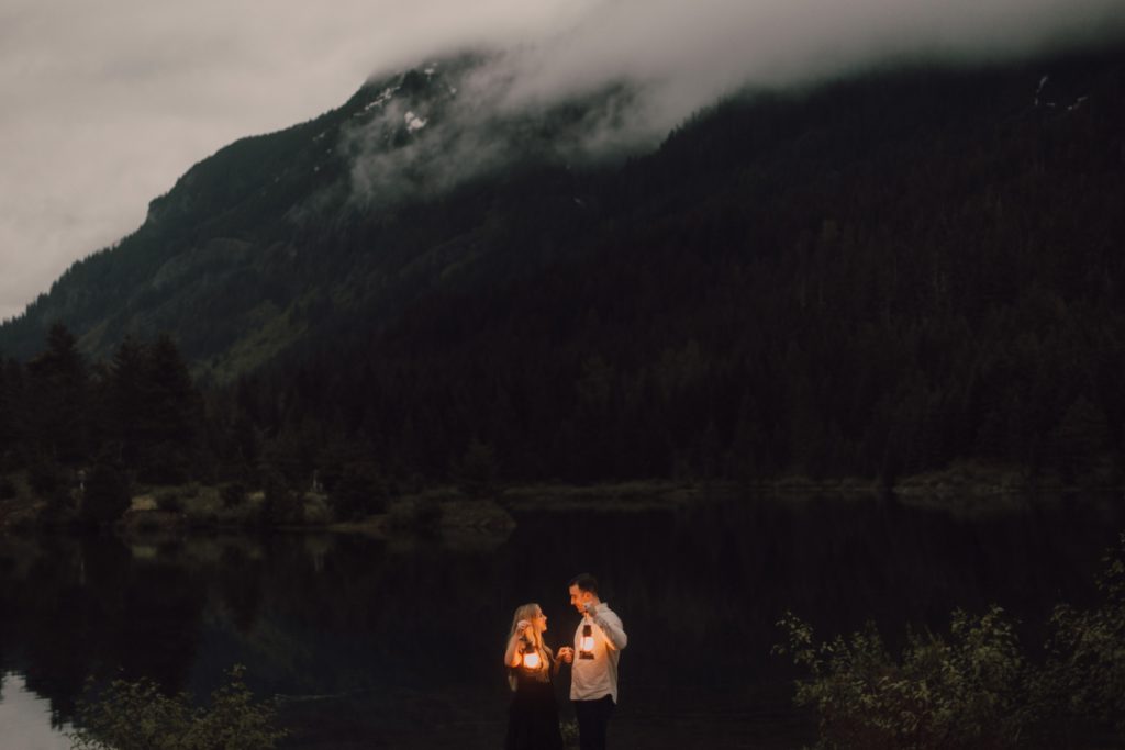 Engaged couple posing in the mountains for an overcast and moody Washington couples session, captured by Riss and Steven. Washington couples photographer, Washington wedding photographer