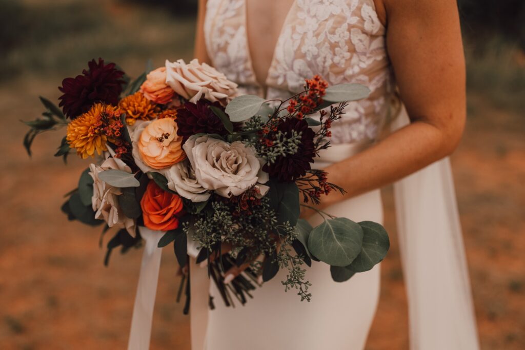 Terracotta autumn bridal bouquet, Bride and groom portraits, Sedona wedding at Red Agave Resort