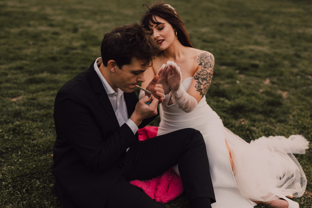 Wedding portraits at Brooklyn Bridge Park smoking a joint 