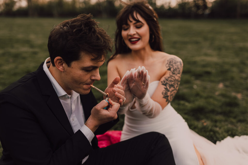 Wedding portraits at Brooklyn Bridge Park smoking a joint 