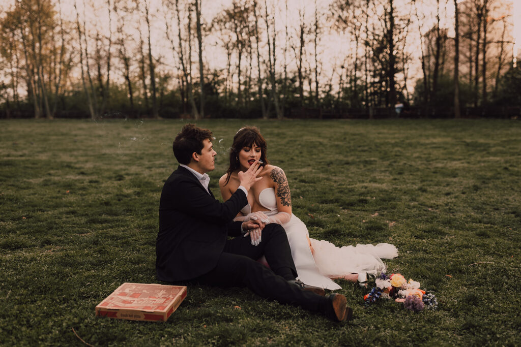 Wedding portraits at Brooklyn Bridge Park smoking a joint 