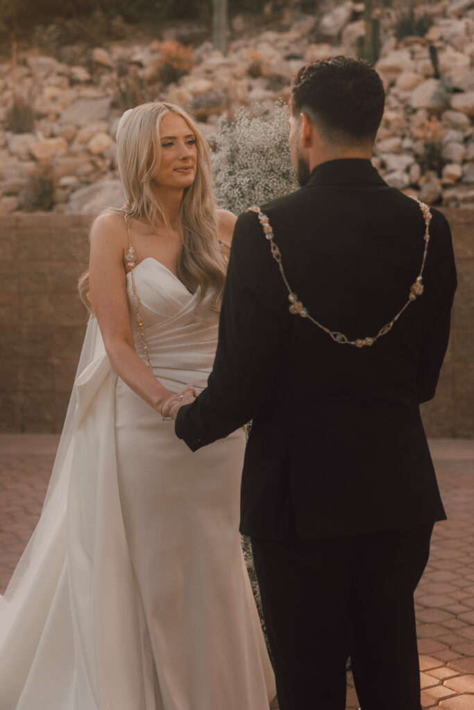 wedding ceremony, i do, wedding photos, bride and groom, bride looking at groom holding hands during the ceremony