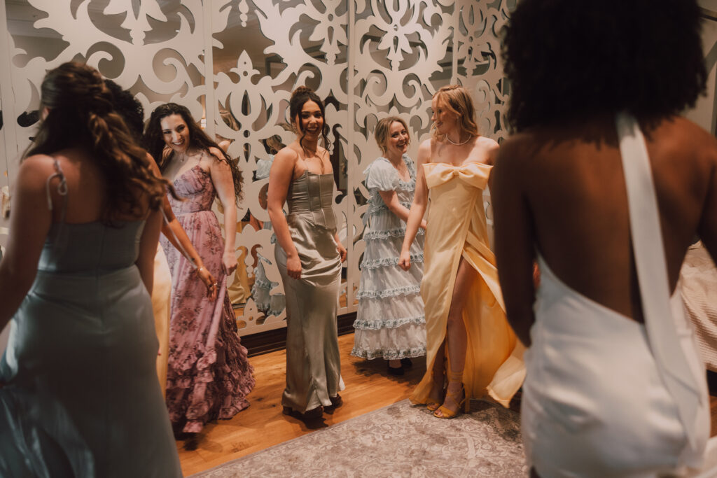 bridesmaids and bride twirling dresses