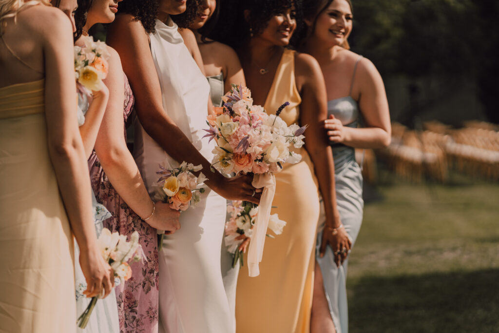 bridesmaids colorful dreses and bouquets