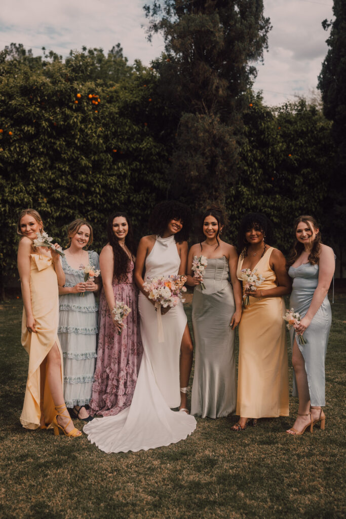 bride and bridesmaids in colorful dresses