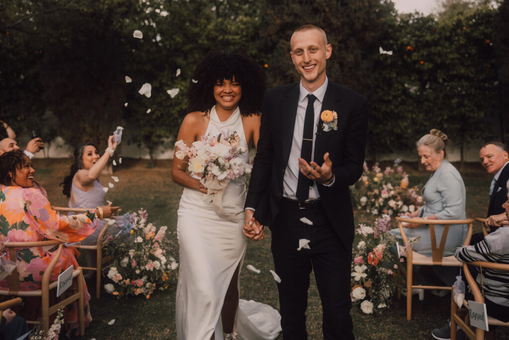 bride and groom ceremony petal toss