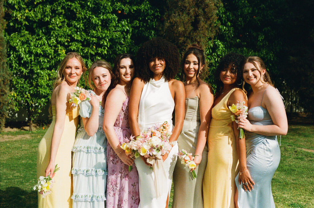 bride and bridesmaids in colorful dresses