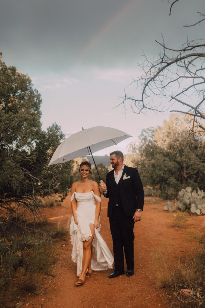 rain on a wedding day bride and groom Sedona elopement sunset