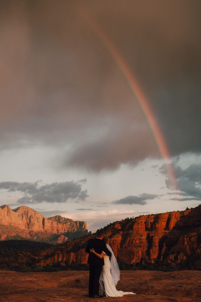 rainbow bride and groom Sedona elopement sunset