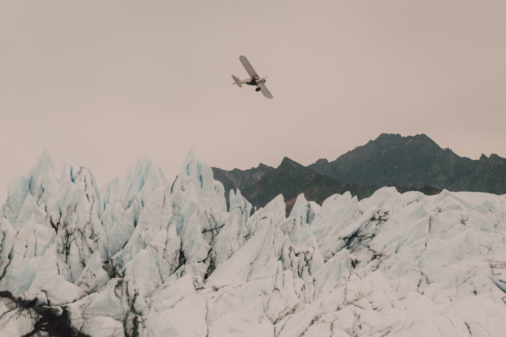 plane flying through glaciers