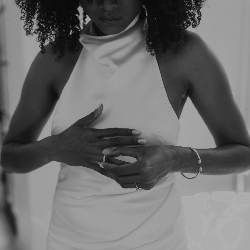 Bride putting on jewlery